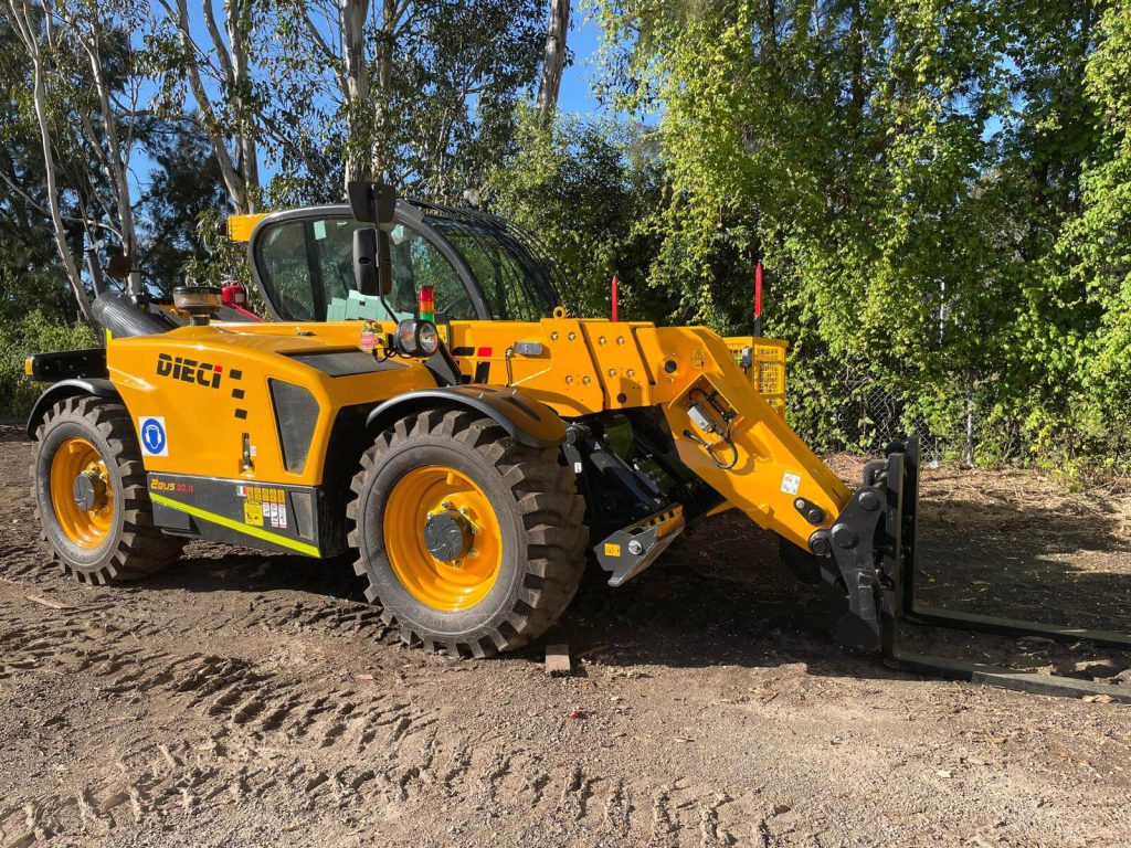 front right side view of a Dieci Zeus 33.11 3.3T Telehandler with its boom equipped with lifting forks lowered