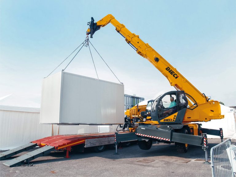 Image shows a Dieci Telehandler lifting a heavy object