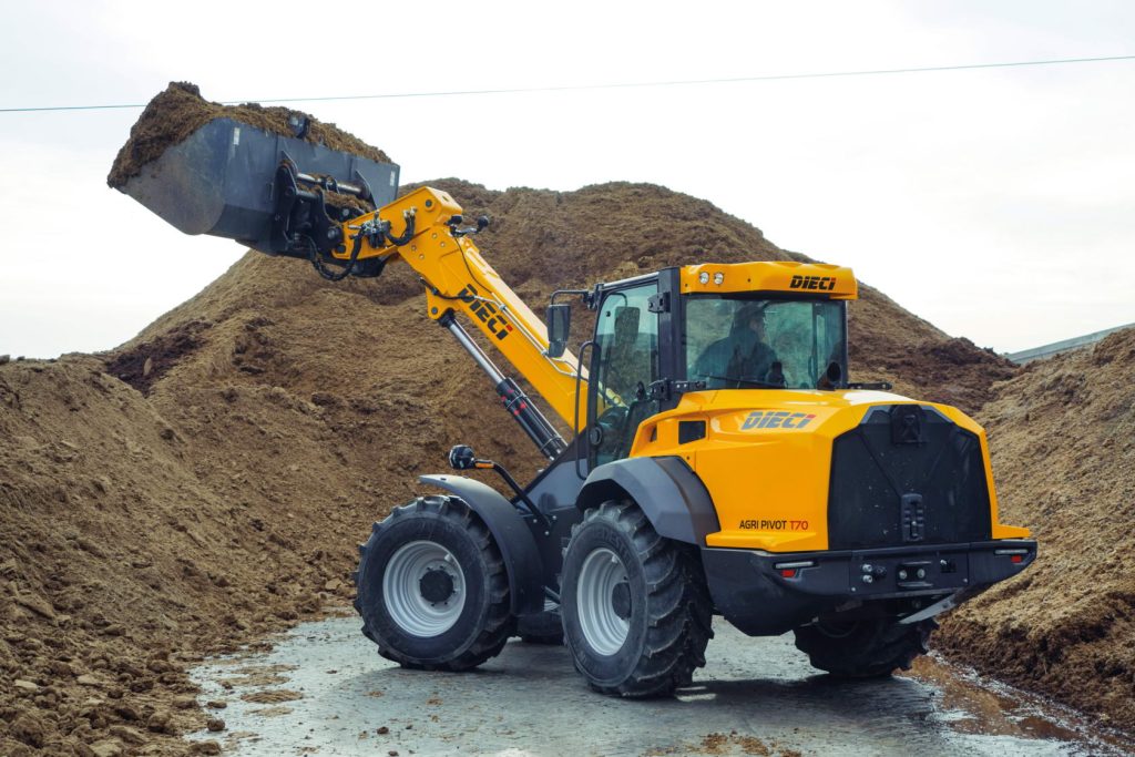 Image shows a DIeci Agri Pivot T70 Telehandler working on a farm in Australia moving dirt and soil