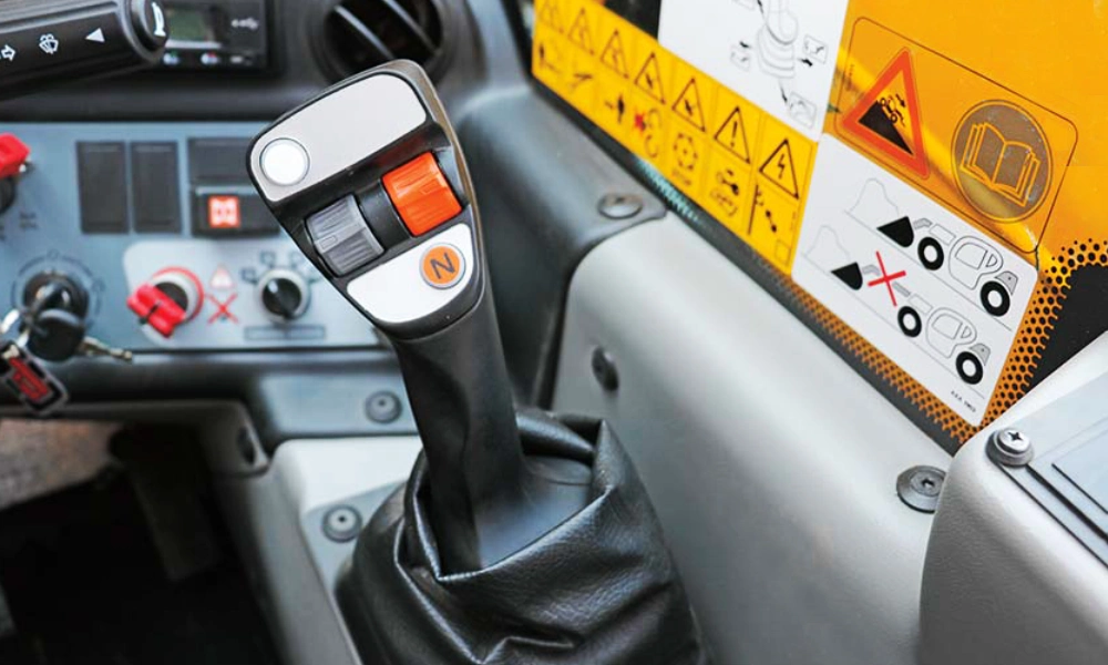 Telehandler interior showing a 4-in-1 proportional joystick for controlling the telehandler