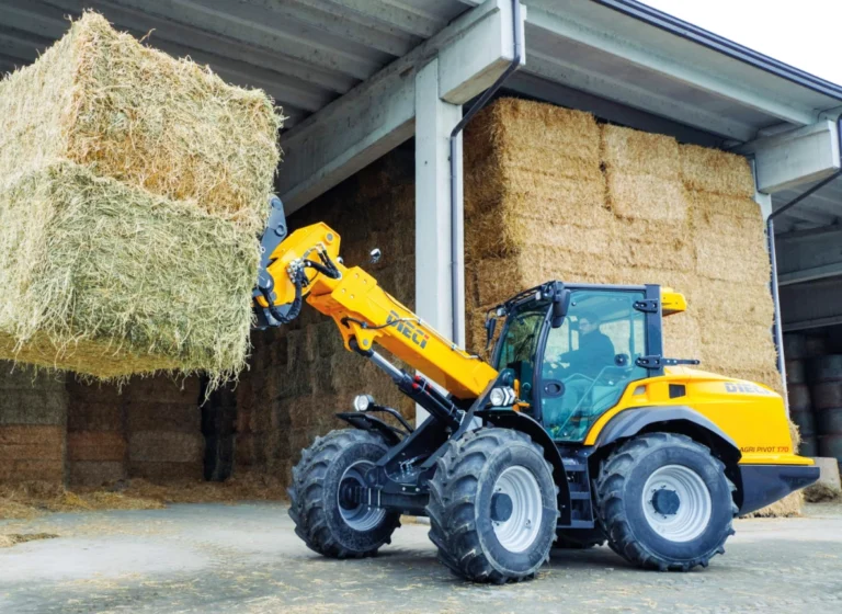 Agri pivot telehandler loading hay bales on an Australian farm