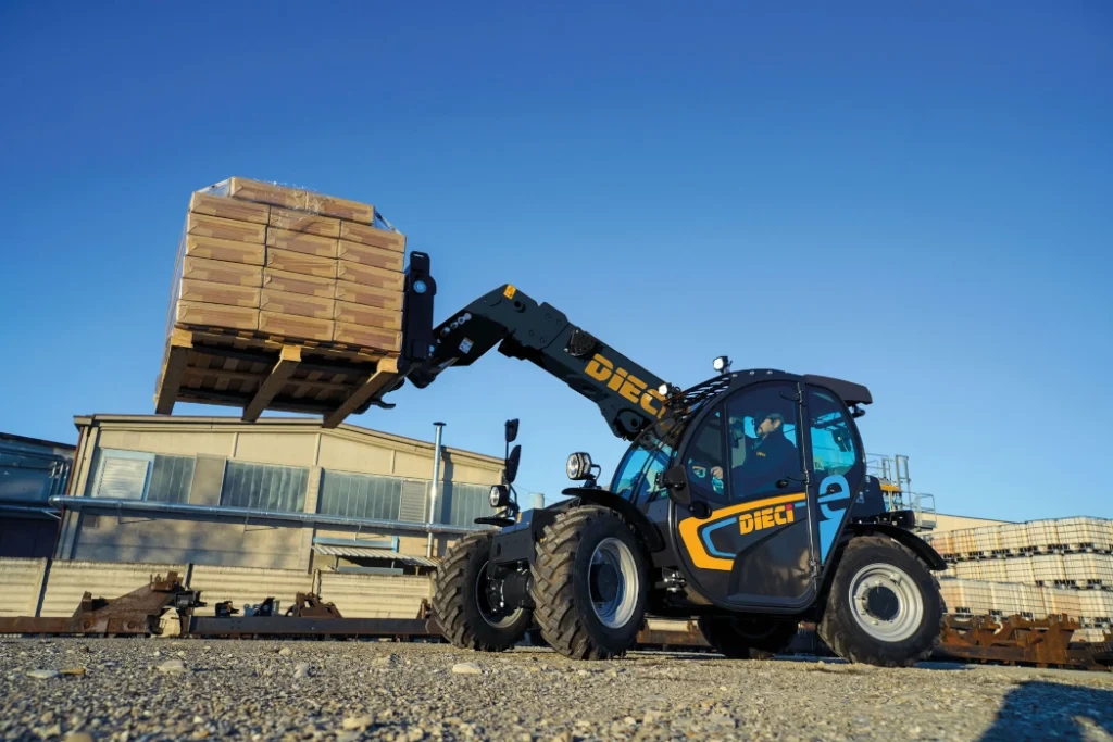 Dieci Apollo-e- 2.6t electric telehandler moving a pallet of materials