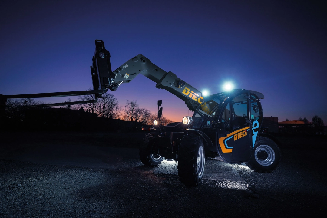 Apollo-e 2.6t electric telehandler working at night time with lights