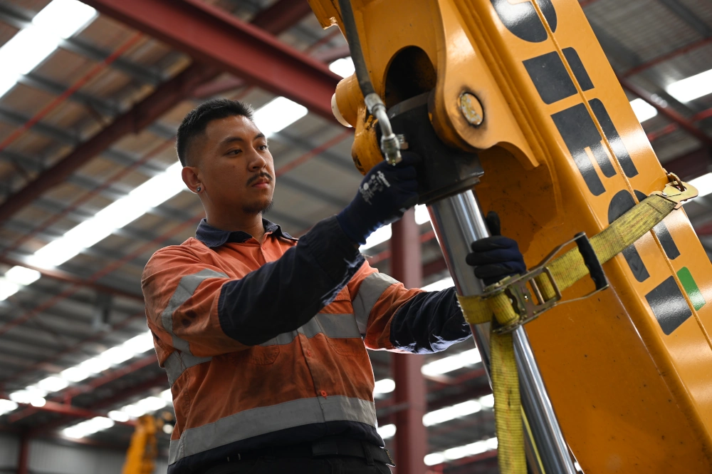 a maintenance technician providing aftersales support and scheduled maintenance on a Dieci telehandler