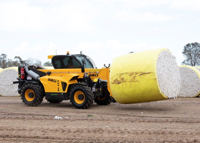 right side view of a Dieci Cotton Pro 7t Telehandler carrying a cotton bale