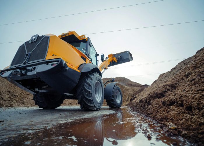Dieci Agri Pivot T70 Telescopic loader working in a rural Australian farm environment to load dirt