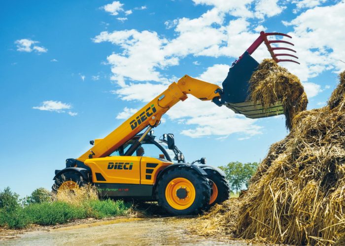 right side view of a Agri Farmer 30.9 3t Agricultural Telehandler lifting a load of hay and fodder on a farm in Perth, WA