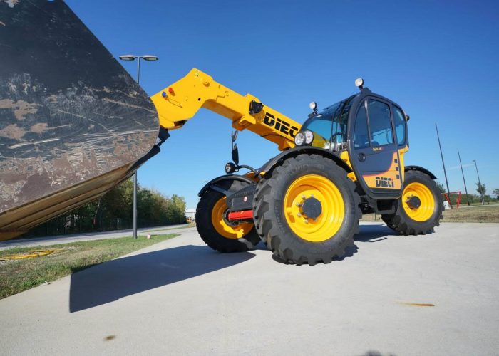 Left side view of the Dieci Dedalus 3t Telehandler holding a large bucket on a project site in Sydney Australia