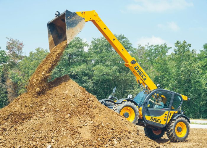 Agri Farmer 30.9 3t Agricultural Telehandler tipping out a heavy load of dirt on a farm in Sydney, NSW