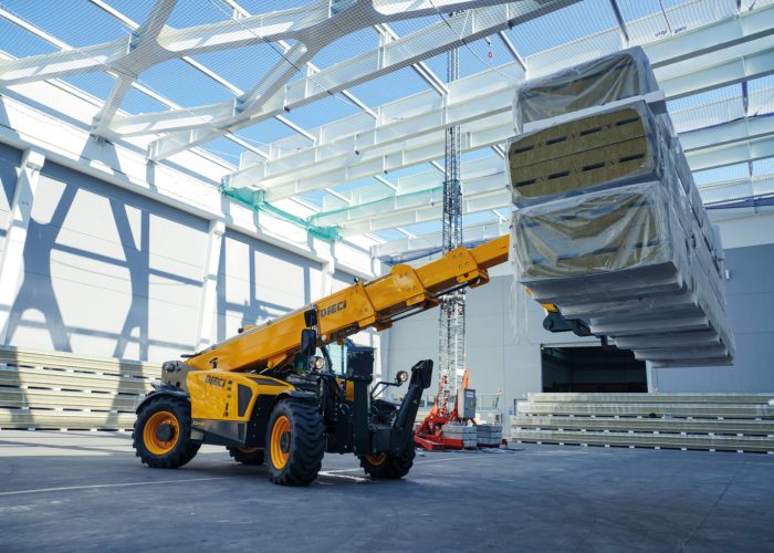 right side view of a Dieci Icarus 40.17 4T Telehandler moving wood construction materials in Perth, Australia
