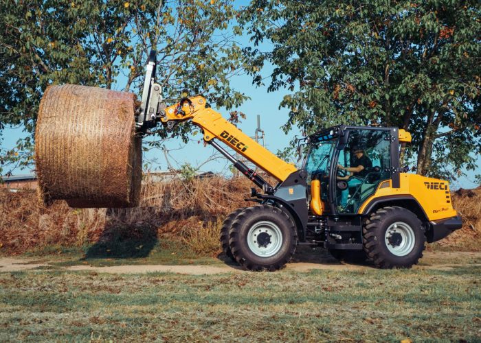 left side view of a Agri Pivot T70 3t Telescopic Loader carrying large hay bales
