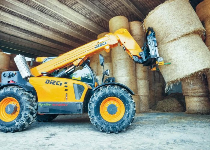 Agri Max 7t Telehandler moving hay bales in a farm supplies shed in Australia