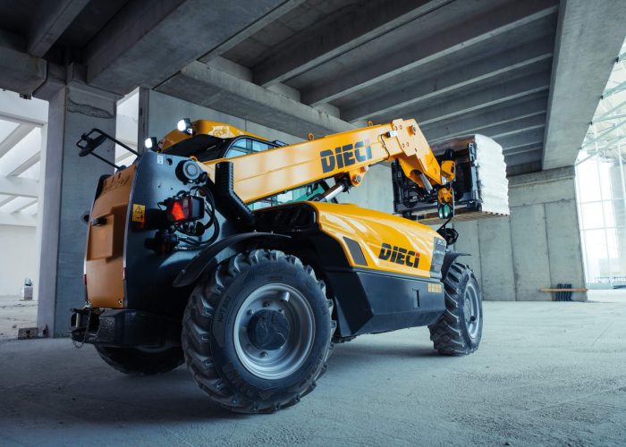 rear left side view of Dieci Apollo 25.6 2.5t Telehandler lifting a 2.5ton load of concrete in an Australian warehouse