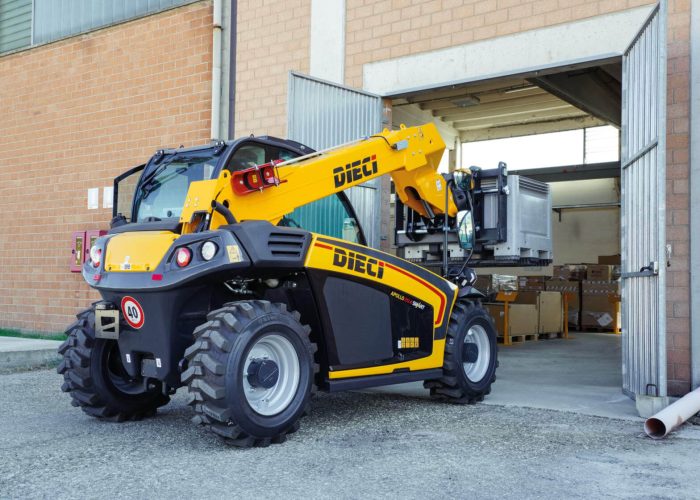Apollo Smart 20.4 2t Compact Telehandler carrying a 2ton load on a pallet for a building project in Australia