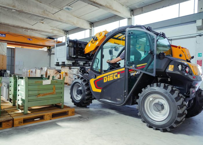 Apollo Smart 20.4 2t Compact Telehandler moving construction materials in a warehouse in Brisbane, Australia