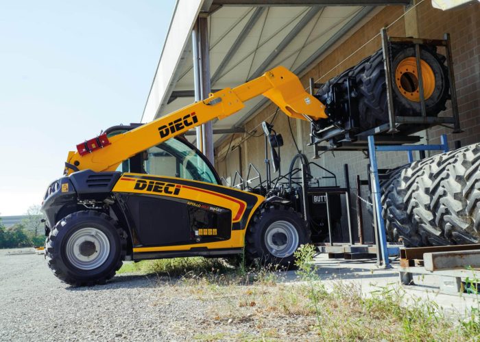 Apollo Smart 20.4 2t Compact Telehandler moving a load of heavy machinery tyres on an Australian farm or construction site