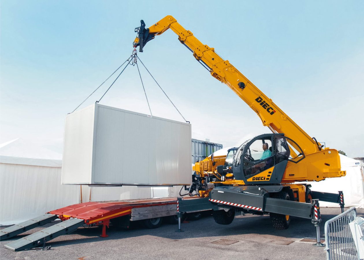Image shows a Dieci Telehandler lifting a heavy object