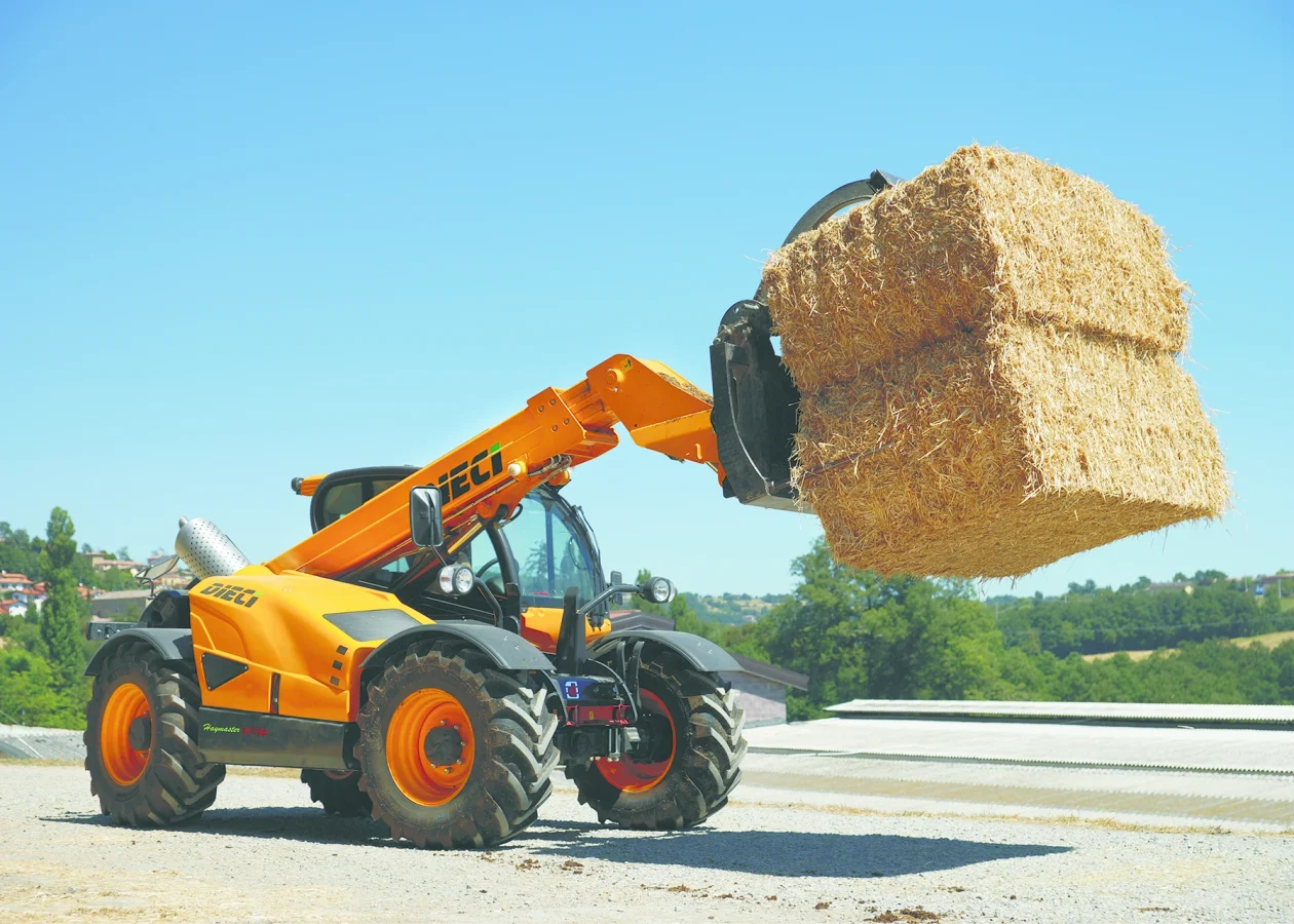 Dieci haymaster 4t telehandler living several large bales of hay on an Australian farm