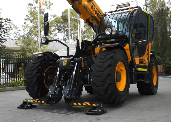 Front view of the Dieci Zeus 33.11 3.3T Telehandler with its boom raised and its stabiliser legs deployed