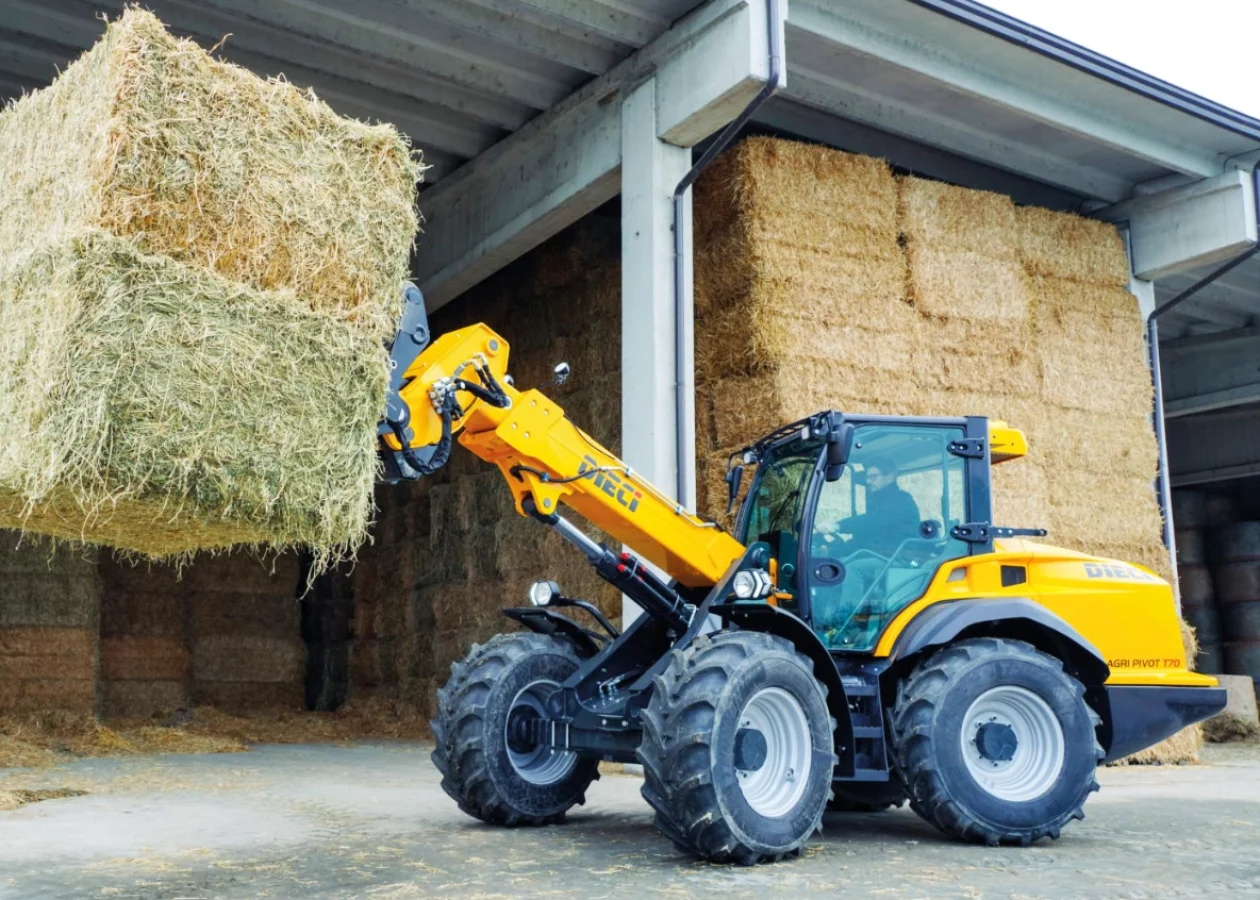 Agri pivot telehandler loading hay bales on an Australian farm