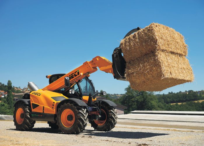 right side view of Agri Plus 40.7 4t Telehandler carrying hay for livestock feed on an Australian farm