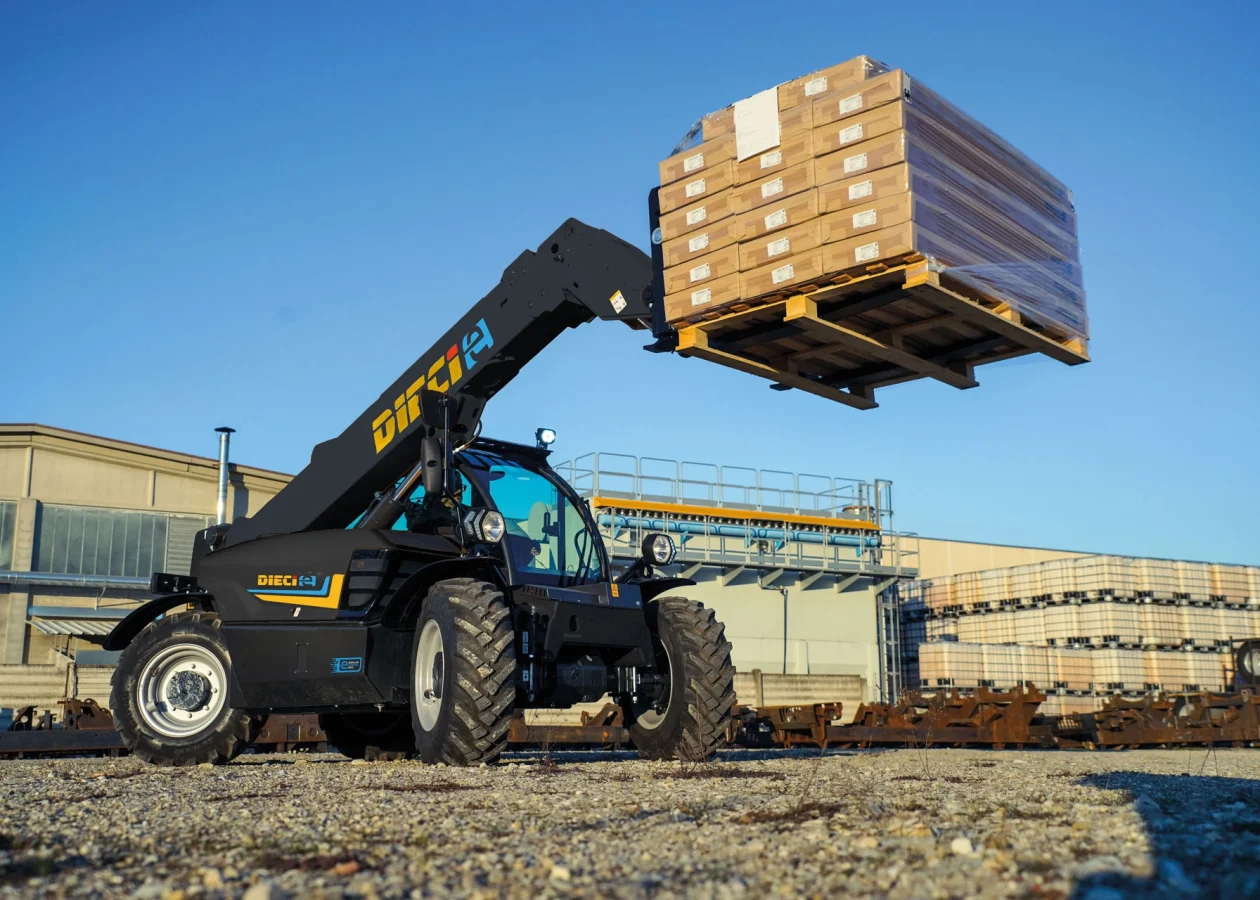 Dieci Apollo-e 2.6T electric telehandler lifting a heavy pallet of materials