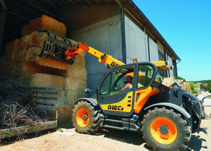 Dieci Haymaster 4t Agricultural Telehandler with 4 tonne lift capacity placing hay bales for animal feed into a storage shed in regional NSW