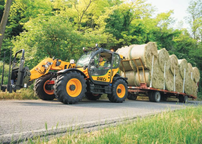Dieci Haymaster 4t Agricultural Telehandler towing a trailer loaded with hay bales on an Australian farm location