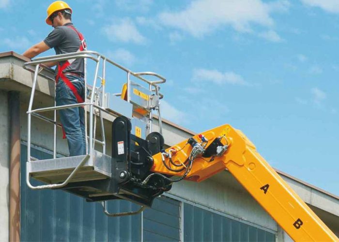Mini Agri 2.5t Agricultural Telehandler equipped with a manbasket EWP performing maintenance work on a farm shed in regional Australia