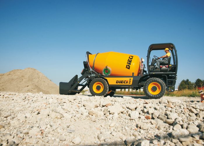 Right side view of the L4700T Concrete Mixer Truck with automatic loader, loading concrete getting ready to pour concrete on an Australian construction site