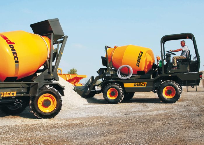 Two L4700T Concrete Mixer Trucks loading concrete into their trucks ready to deliver it to Australian building sites