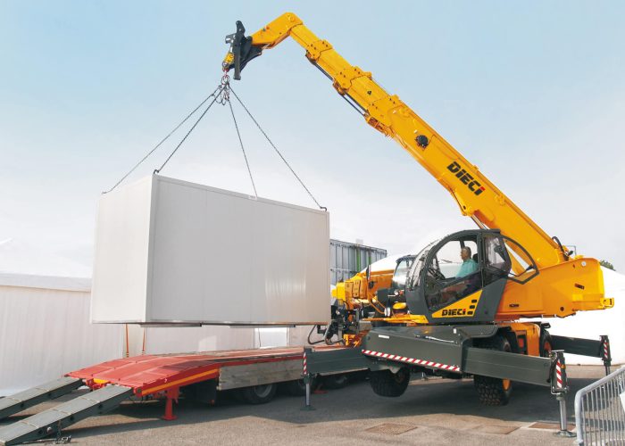 Dieci Pegasus 400° 3.8t Rotating Telehandler lifting a large heavy concrete block on an Australian construction site