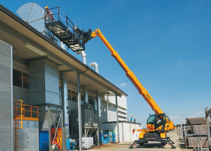 Dieci Pegasus 400° 4t Rotating Telehandler lifting a man basket up for maintenance and construction workers to perform task on a construction build in Australia