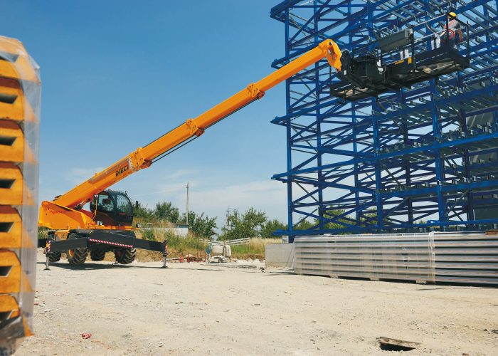 Pegasus 360 40.25 4t rotating telehandler with a man basket allowing workers to reach high locations on an Australian construction project