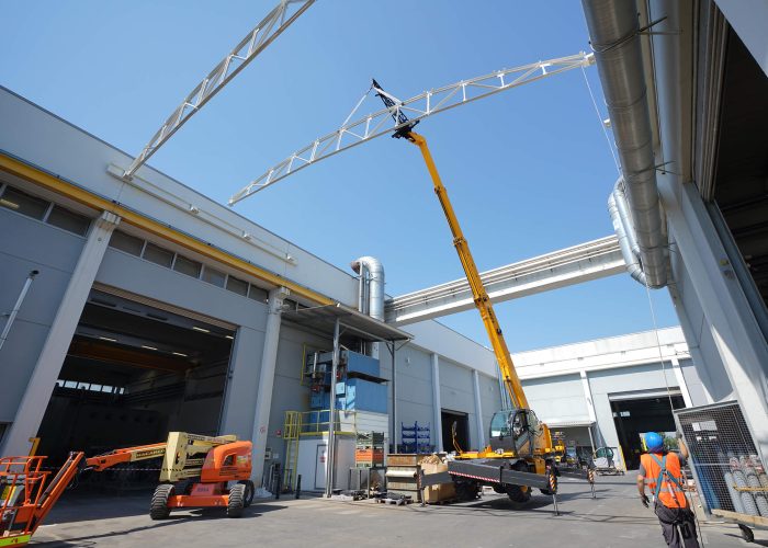 Pegasus 360 40.25 4t rotating telehandler working on an Australian construction project to lift a large steel beam to a high location