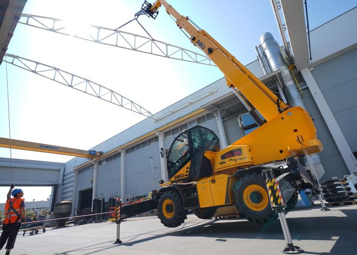 Pegasus 360 40.25 4t rotating telehandler performing a precision lift on a Melbourne construction site lifting a heavy steel building beam