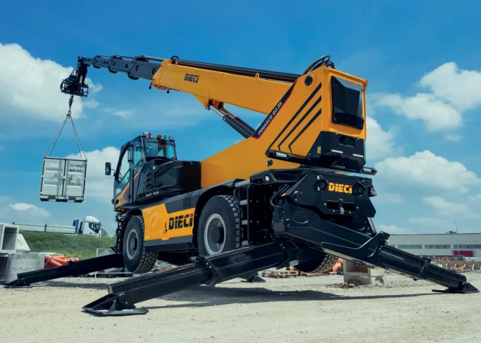 rear view of a Dieci Pegasus 60.21 6t rotating telehandler with its boom raised and outriggers deployed