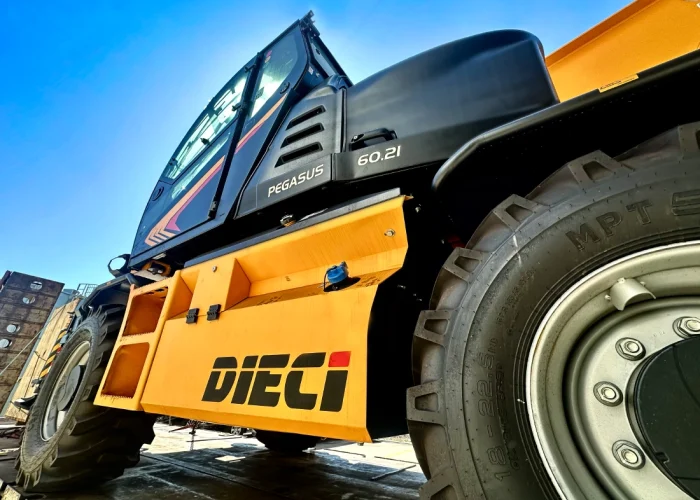 close up side view of a Dieci Pegasus 60.21 6t rotating telehandler showing its tires, cab, and dieci logo