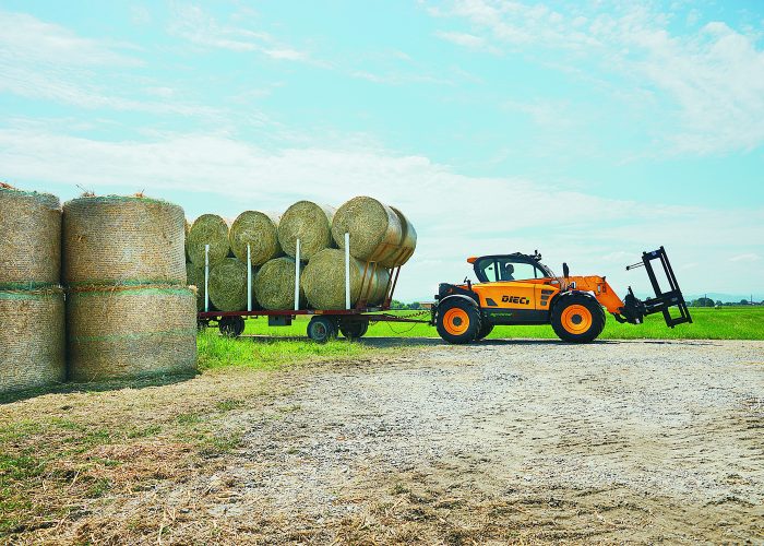 Dieci Piggery Pro 3t Telehandler towing a trailer with pig feed and hay bales in Melbourne, Australia