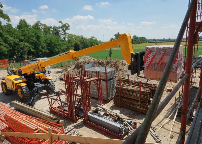 Right side view of a Dieci Runner 40.13 4T Telehandler with its boom fully extended placing heavy materials with precision in Sydney Australia